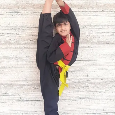 This young student achieved this perfect standing split after just one year of training. It’s a testament to the power of consistent practice in developing flexibility, balance, and focus.