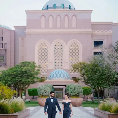 Walking hand-in-hand through the magnificent grounds of the Emirates Palace in Abu Dhabi. This is elegance and romance on a grand scale for a truly palatial pre-wedding shoot.