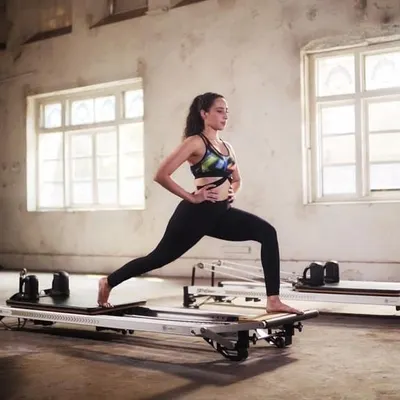 A lunge on the Reformer is a classic Pilates exercise for building leg strength and improving flexibility. We guide you to maintain an upright posture and engage your core throughout the movement.