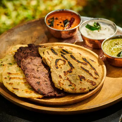 A wholesome and balanced Ayurvedic meal. This platter features Ragi and Rice Roti, served with a variety of chutneys and vegetable preparations, all designed to nourish the body and please the senses.