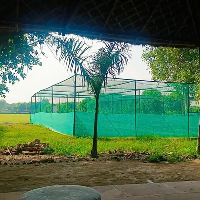 A view of our four practice nets with turf wickets, right next to the main ground. This is where the hard work happens every day.