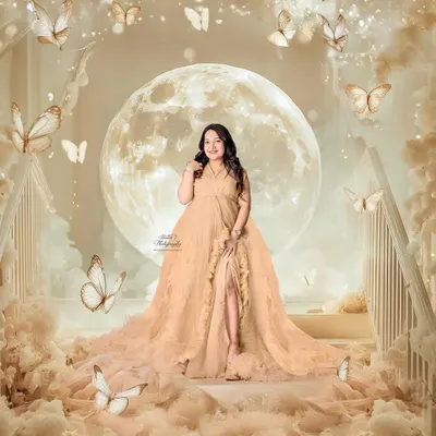 A true fairytale moment. This fantasy composite, created in my studio, features a glowing moon, soft clouds, and butterflies to capture the magical feeling of expecting.