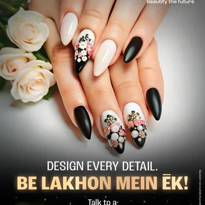 A closer look at the intricate 3D floral designs you can learn to create. This look combines a matte black and neutral base with delicate, hand-sculpted flowers, showcasing the high level of detail taught in our pro nail art course.