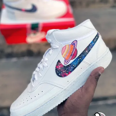Take your love to the cosmos with these matching galaxy-themed Nike high-tops. One shoe features a vibrant, hand-painted galaxy swoosh with the planet Saturn, perfect for a couple's set.