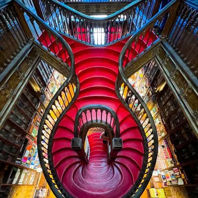 The famous crimson staircase of Livraria Lello in Portugal. This architectural marvel, rumored to have inspired the staircases at Hogwarts, is a breathtaking example of artistry in design. The carved wood, flowing lines, and bold color are incredibly inspiring.
