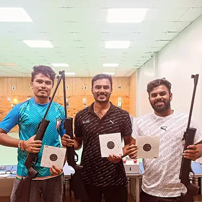 The look of success. These guests are happy to show off their target sheets after a session of air rifle practice, demonstrating great accuracy.