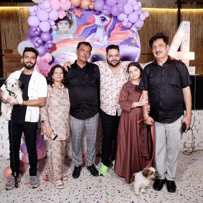 It’s a family affair. I love seeing families and their furry friends celebrate milestones with us. This photo captures a happy moment from a 4th birthday party we hosted.