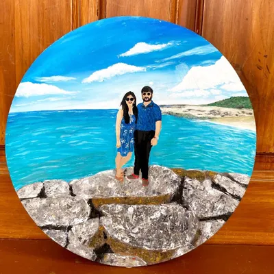 An anniversary gift that tells a story. This custom couple portrait was painted from a photo, capturing a happy memory on a circular canvas that can be displayed for years to come.
