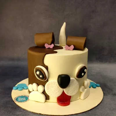 A pawsitively delicious cake designed to look like a cute dog's face. This cake is perfect for a dog lover's birthday or even a celebration for a beloved pet.