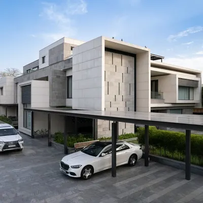 The exterior of Residence 338 features a bold, geometric facade with a covered carport. The design balances privacy with a strong street presence, using a monochrome palette of stone and plaster.