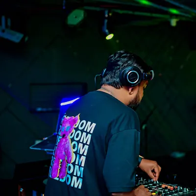 A shot from behind while I'm deep in a Bollytech mix. This genre is all about powerful basslines and familiar melodies, creating an irresistible urge to dance.