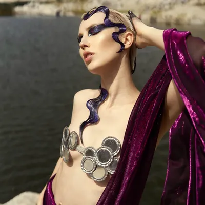 The full 'Siren of the Sea' look. The makeup extends from the face to the hair and hands, paired with a custom mirror bralette to complete the mythical creature concept.