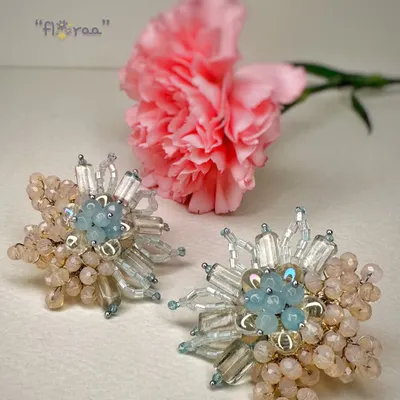 Be a showstopper with these classic handcrafted fashion studs, featuring a beautiful floral design in pastel blue and peach.