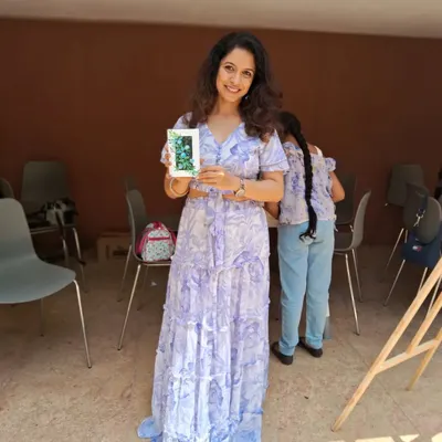 Meet Poonam, one of our lead artists, holding up a small, beautiful piece created during a workshop. She brings her expertise in color and creativity to guide participants through each step of the process.