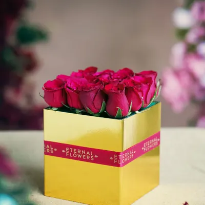 My signature luxury flower box, a simple and elegant statement. This golden box filled with vibrant pink roses is a timeless way to express love and appreciation.