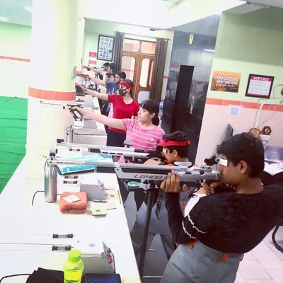 Our range accommodates both pistol and rifle shooters simultaneously. Here you can see a mix of students, young and old, practicing their chosen discipline side by side.