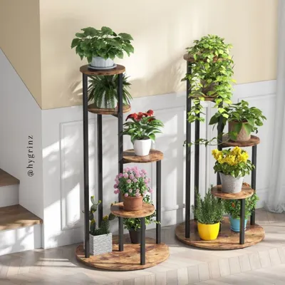 This 4-tier plant stand is an elegant way to create a vertical garden without a wall installation. Its tiered design gives each plant access to sunlight and adds a modern decorative touch to any indoor space or balcony corner.