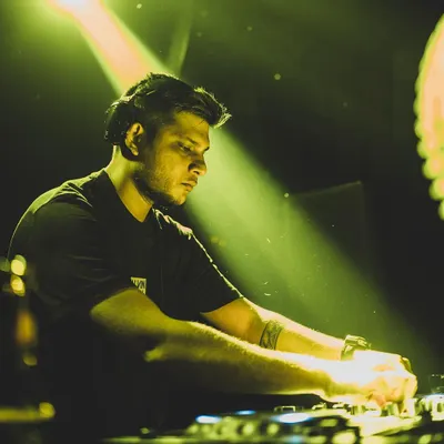 In the zone, focused on the mix. I use professional Pioneer DJ gear to ensure every transition is seamless and the sound quality is perfect for your event.