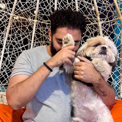 This is the kind of love we see every day. A quiet moment of connection between a pet parent and his best friend is what makes our cafe more than just a place; it's a home for dog lovers.