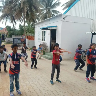 Young members of our shooting camp participate in outdoor fitness exercises. These drills are essential for building the physical stamina and discipline required for precision sports like shooting.