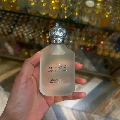 The popular Ana Abiyedh Hair Mist, a special find from a previous trip to Dubai. I was holding it in my hand against a backdrop of beautiful perfume bottles in the store.