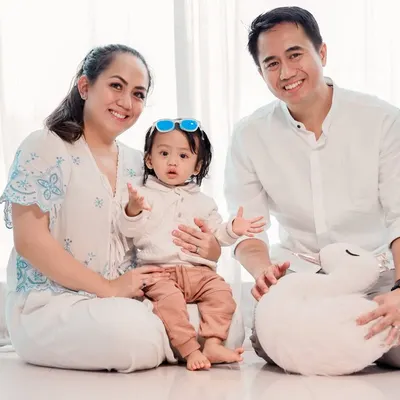 A beautiful family portrait against a clean, white backdrop. This minimalist style is bright and modern, ensuring that the focus remains entirely on your family's happy expressions.