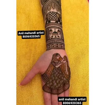 This custom design features a bride figure on the palm. Above her, the arm is decorated with an elephant motif and a depiction of a palace, telling a royal wedding story.
