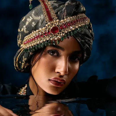 A creative jewellery campaign shot. We used water to add an element of surprise and reflection, making the traditional turban and jewellery feel modern and artistic.