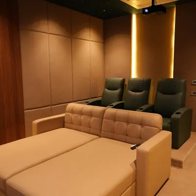 A recent project in Nellore featuring a convertible sofa bed in the front, perfect for casual viewing, with traditional cinema recliners in the back row.