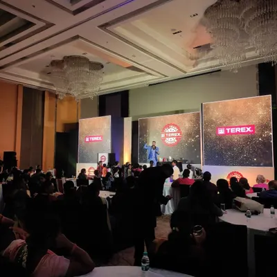 On stage for Terex Corporation at the Marriott, Whitefield. The grand ballroom setting was perfect for a large-scale corporate show with multiple LED screens and a full audience.