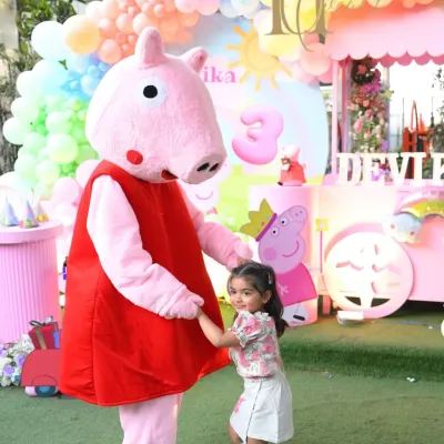 The highlight of any themed party is a visit from the main character. Here, the birthday girl shares a special moment with our Peppa Pig mascot, creating a memory she will cherish forever.