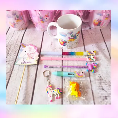 This is what's inside my whimsical unicorn mug gift set. It includes a unicorn mug, a variety of themed stationery like pens and erasers, a keychain, and a personalized "Sparkle like a Unicorn" tag.