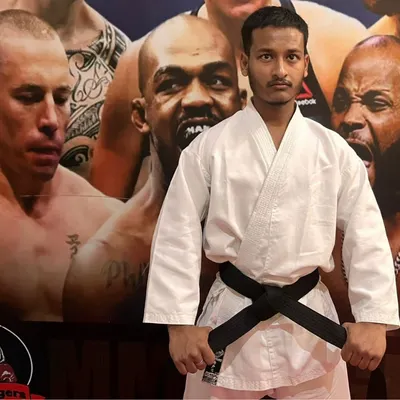 This is me in my karate gi, holding my black belt. It represents years of dedication, discipline, and mastery that I bring to every training session.