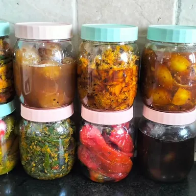 A selection of my pickles, all bottled up and ready to be enjoyed. This lineup includes stuffed red chilli, mixed vegetable, and sweet lemon pickle.