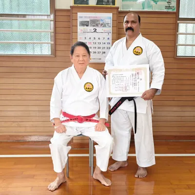 With my teacher, Hanshi Minoru Nakazato, after being awarded the 7th Dan Kyoshi certificate. Receiving this rank in Okinawa, the home of karate, is a responsibility I hold with great respect.
