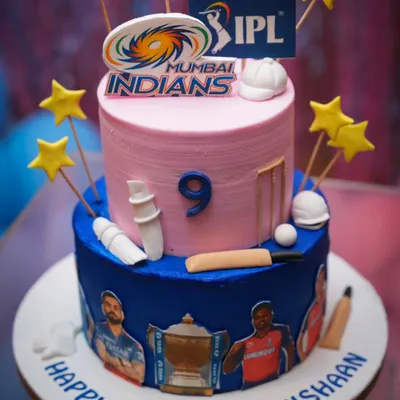 A fantastic two-tiered cricket-themed cake for a true fan. The details, from the wickets to the team logos, are all carefully crafted.