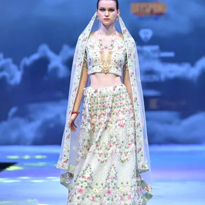 This ivory lehenga from my GULFAM collection is a garden in bloom. The delicate, multi-colored floral embroidery is entirely handcrafted, creating a look that is fresh, modern, and deeply rooted in artistry.