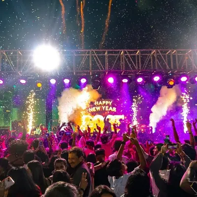 Ringing in the New Year with a bang. This shot captures the peak moment with pyros, smoke, and a sea of phones lighting up the sky. This is the high-octane production I deliver for major events.