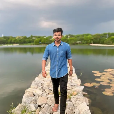 Walking along the stone causeway at this serene lake in Bengaluru. It's a perfect spot for a weekend evening.