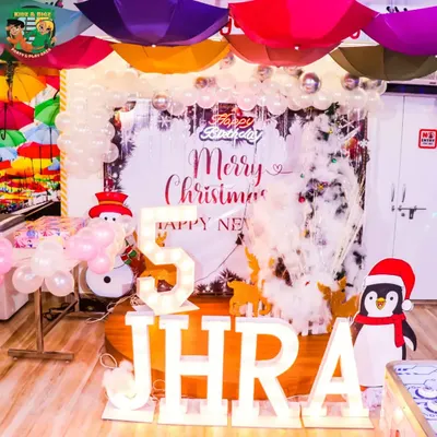 This was the setup for Jhra's magical 5th birthday, which had a full Christmas theme. We arranged the marquee lights, winter wonderland backdrop, and balloon arrangements to create a festive and personalized party atmosphere.