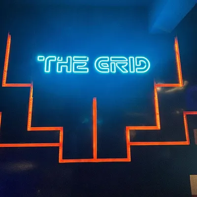 The iconic neon sign of The Grid. This is the beacon of fun you look for when you need an epic day out.