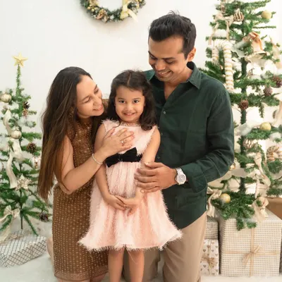 A beautiful family portrait from my Christmas mini-sessions. The festive trees and soft lighting create a magical holiday atmosphere for this sweet photo.