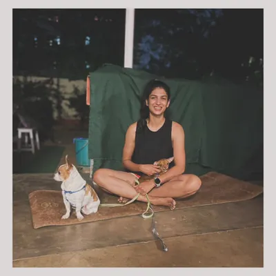 Just a girl and her dogs, sitting on a yoga mat. My pets are a huge part of my life and often join my practice. Come join my classes for some movement and good vibes.