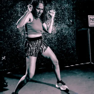 Life is tough, so I train tougher. This shot captures the intensity and passion I bring to every class, whether it's lifting weights or leading a high energy Zumba session.