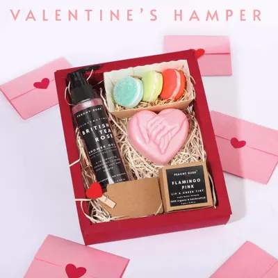 My Valentine's Day special hamper, packed in a classic red box. It features a British Tea Rose shower gel, a 'hand in hand' heart soap, and fun macaron soaps, plus a handwritten note.