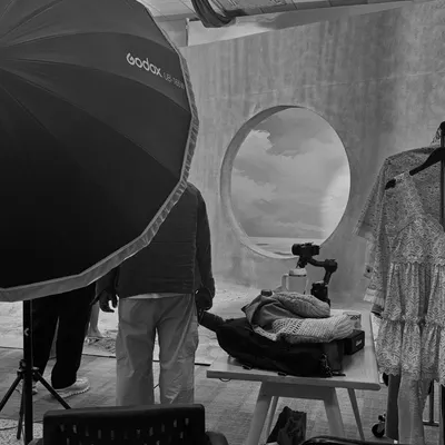 A behind-the-scenes look at the Qala Clothing shoot, showing the set construction and lighting equipment used to create the final look.