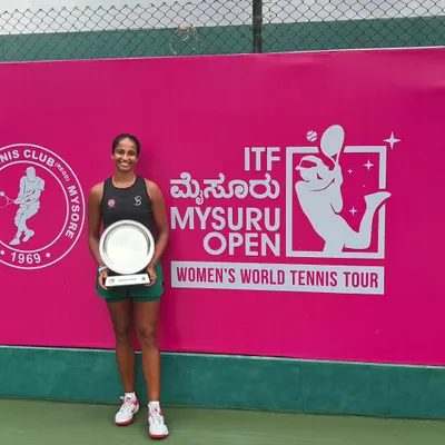 Celebrating a significant victory on the international stage. Our player Riya Bhatia proudly holds the doubles championship trophy at the ITF W15 Mysuru Open, a key milestone on the Women's World Tennis Tour.