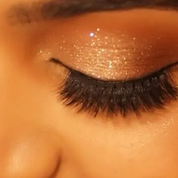 A macro shot of pure sparkle. This is where I focus on the details, layering fine glitter to create a dazzling, multi-dimensional effect that catches the light with every blink.