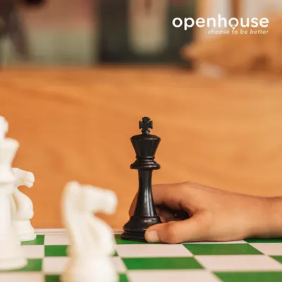 What moves are you making? A close-up on a chess game, symbolizing the strategic thinking and planning we cultivate in our classes.