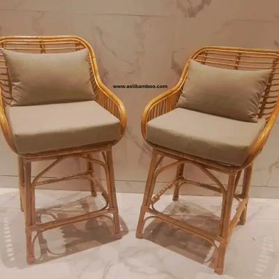 This pair of premium rattan bar chairs brings a touch of tropical sophistication to any home bar or kitchen counter. The high back and included cushions ensure they are as comfortable as they are stylish.